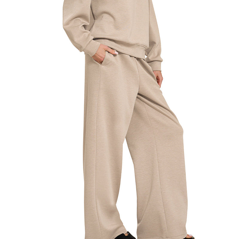 Woman wearing a beige outfit on a white background