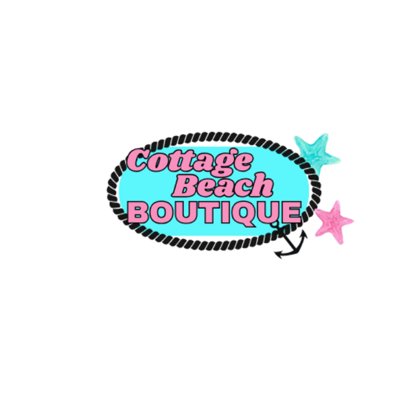 Logo for Cottage Beach Boutique with a blue oval, pink text, and decorative elements on a white background.