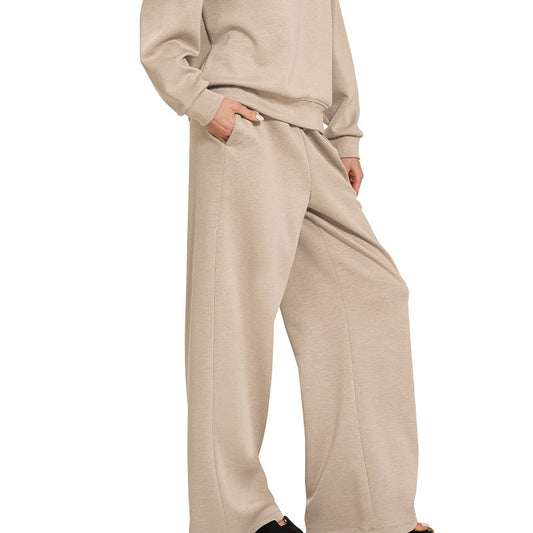 Woman wearing a beige outfit on a white background