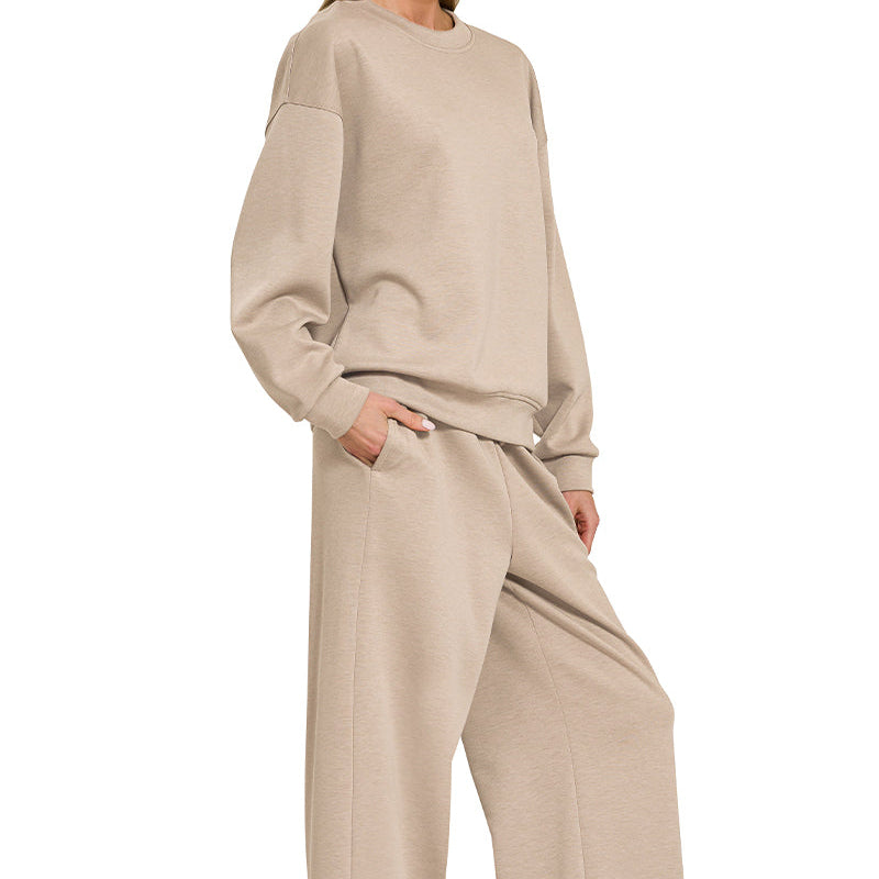 Woman wearing a beige outfit on a white background