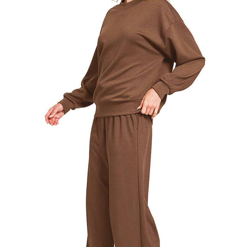 Woman wearing a brown outfit on a white background